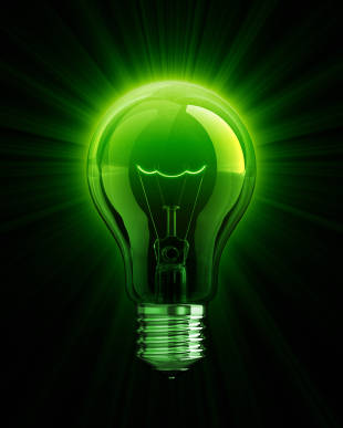 Green glowing energy-saving light bulb