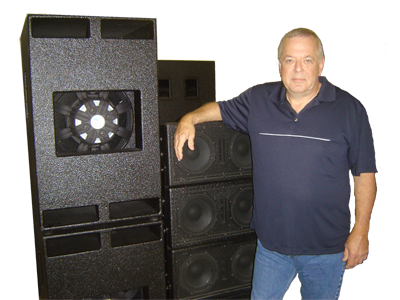 The audio mentor beside his speaker cabinets